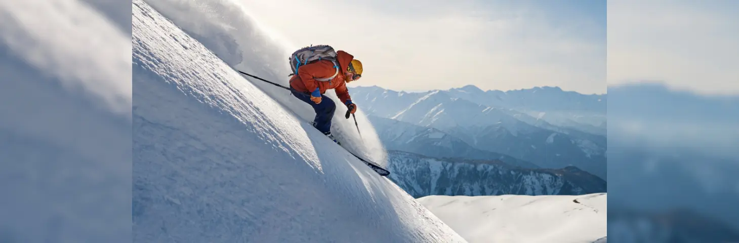 Image of a man skiing down a hill. 