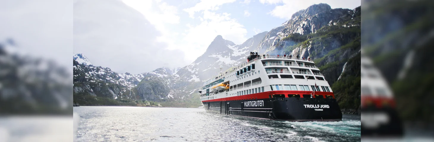 Hurtigruten's MS Trollfjord vessel sailing in the Norwegian fjords.