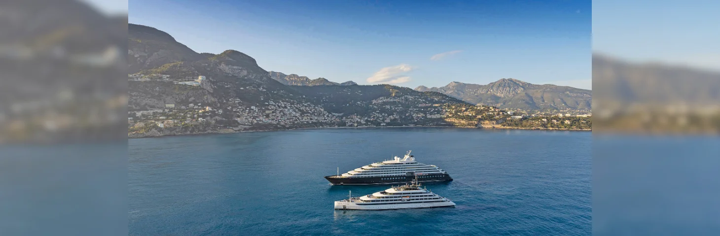 Scenic Eclipse II and Emerald Azzurra at sea, sailing past Monte Carlo.