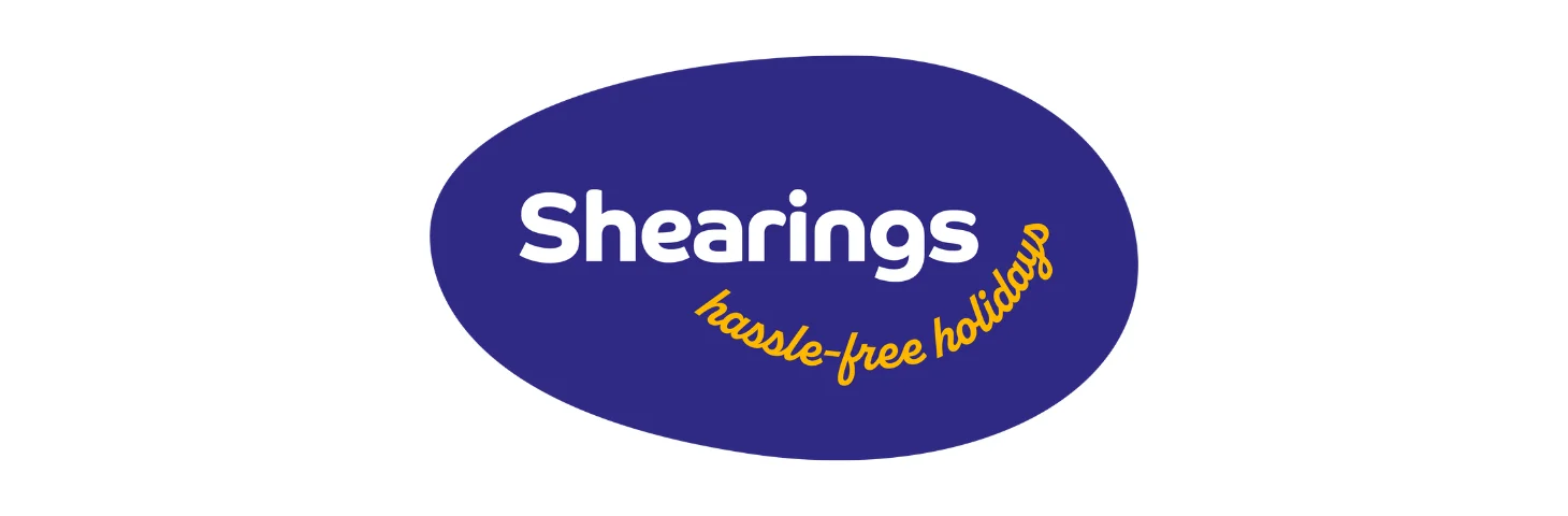 The newly redesigned Shearings logo, featuring a purple oval with the words 'Shearings: Hassle-Free Holidays' written inside.